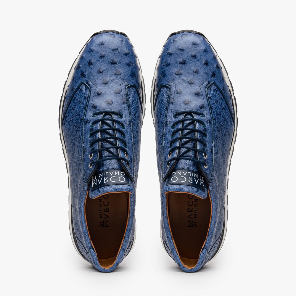 The Marco Di Milano Scanno Antique Navy sneaker features genuine ostrich quill leather in blue, black laces, a white and black rubber sole, and textured details—luxury footwear displayed on a white background.