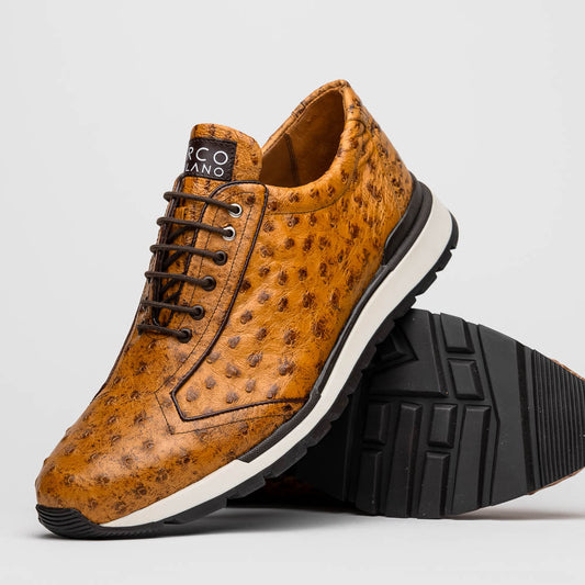 The Scanno Antique Paja sneakers by Marco Di Milano feature real ostrich quill leather with a hand-painted finish, brown leather, black laces, and white-accented soles—one shoe propped on the other against a white background.