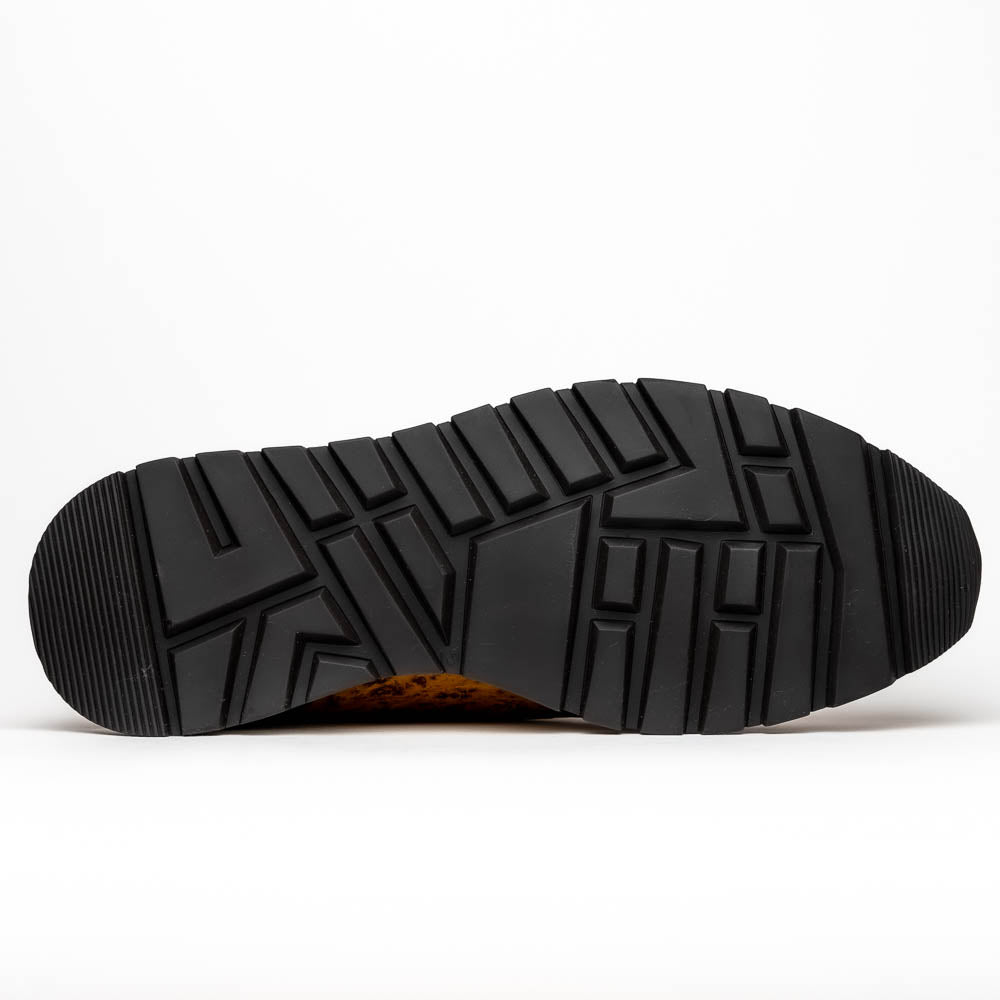 The Scanno Antique Paja sneakers by Marco Di Milano feature real ostrich quill leather with a hand-painted finish, brown leather, black laces, and white-accented soles—one shoe propped on the other against a white background.