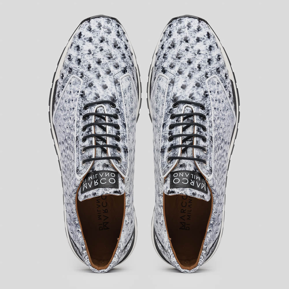 The Marco Di Milano Scanno Newspaper sneakers feature a luxurious hand-painted white and black textured lace-up design with thick black rubber soles, displayed against a plain white background.