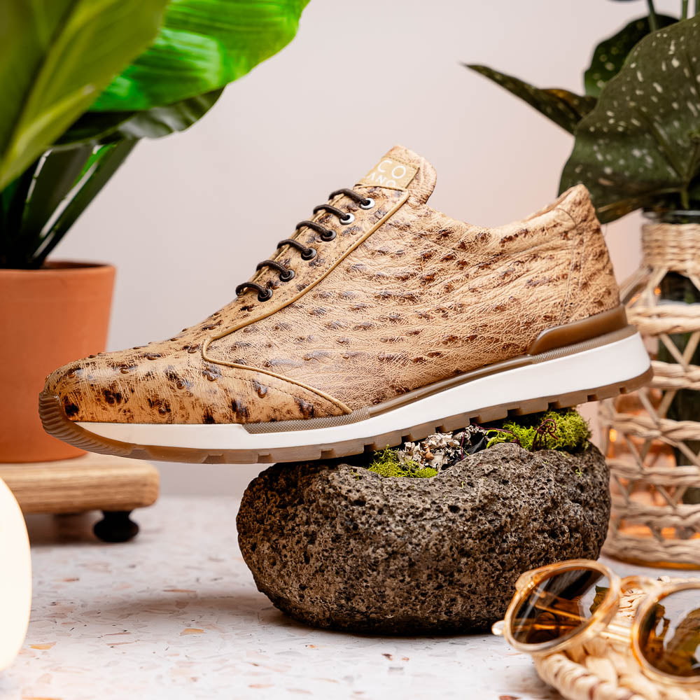 The Scanno Antique Orix by Marco Di Milano is a pair of tan, textured lace-up casual shoes with a hand-painted finish and brown rubber soles, shown against a white background—ideal for luxury footwear enthusiasts.