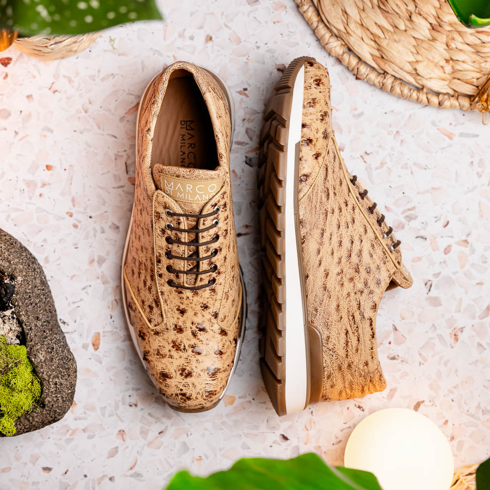 The Scanno Antique Orix by Marco Di Milano is a pair of tan, textured lace-up casual shoes with a hand-painted finish and brown rubber soles, shown against a white background—ideal for luxury footwear enthusiasts.
