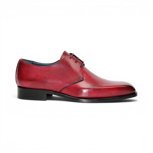 The Duca Di Matiste Duca Sermoneta Antique Red is a premium Italian calf leather dress shoe in red, featuring black laces and a black sole. Displayed in profile on white, it's ideal for classic elegance lovers.