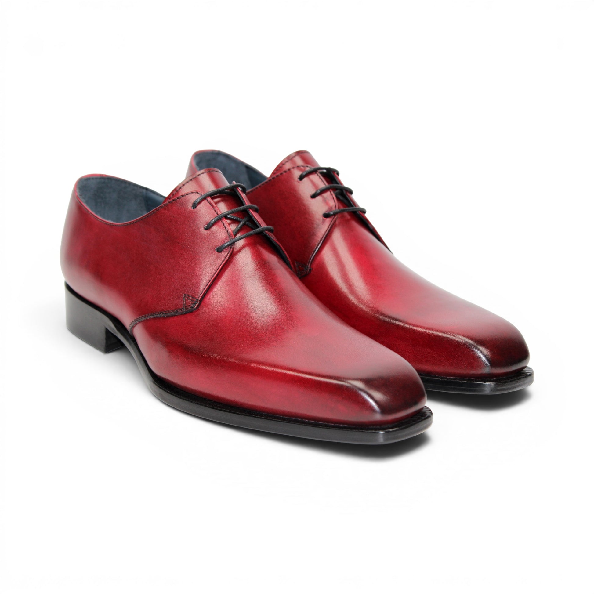 The Duca Di Matiste Duca Sermoneta Antique Red is a premium Italian calf leather dress shoe in red, featuring black laces and a black sole. Displayed in profile on white, it's ideal for classic elegance lovers.