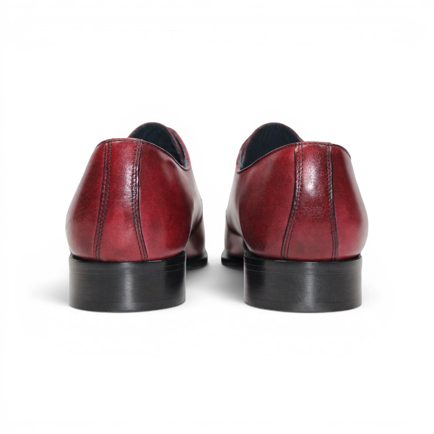 The Duca Di Matiste Duca Sermoneta Antique Red is a premium Italian calf leather dress shoe in red, featuring black laces and a black sole. Displayed in profile on white, it's ideal for classic elegance lovers.