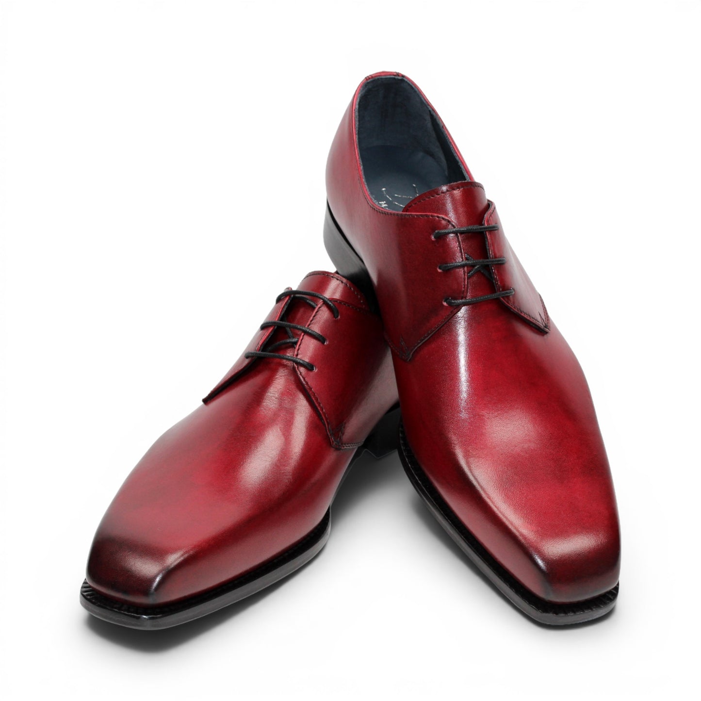 The Duca Di Matiste Duca Sermoneta Antique Red is a premium Italian calf leather dress shoe in red, featuring black laces and a black sole. Displayed in profile on white, it's ideal for classic elegance lovers.