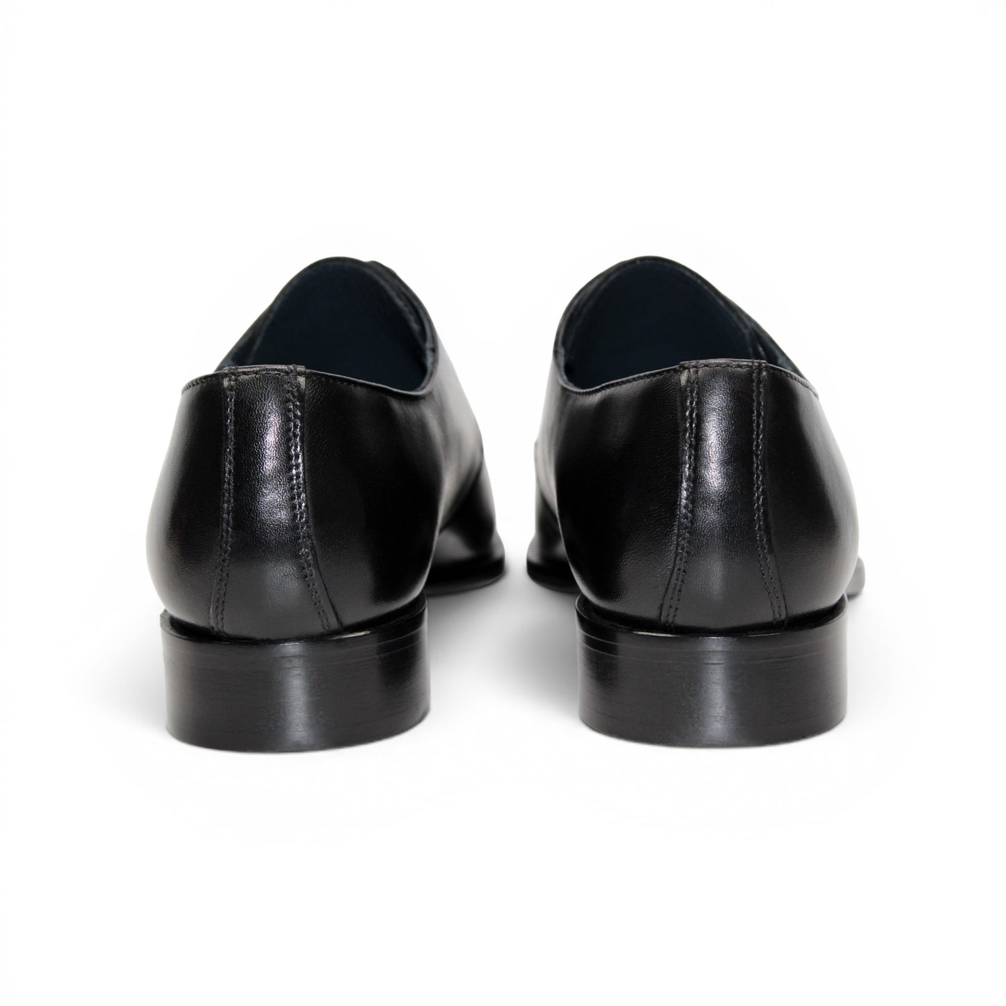 The Duca Sermoneta Black by Duca Di Matiste is a sleek, polished Italian leather dress shoe with laces and a low heel, exuding classic elegance against a white background.
