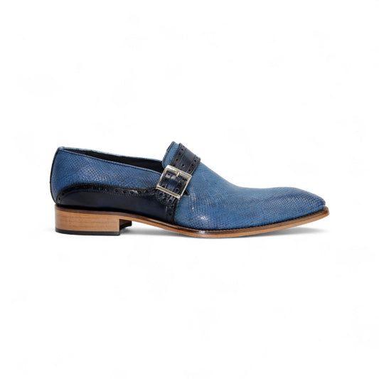 The Duca Di Matiste Duca Sezze Powder Blue/Navy is a luxury leather shoe with blue texture, side buckle, low wooden heel, and pointed toe, crafted in Italy and shown on a white background.