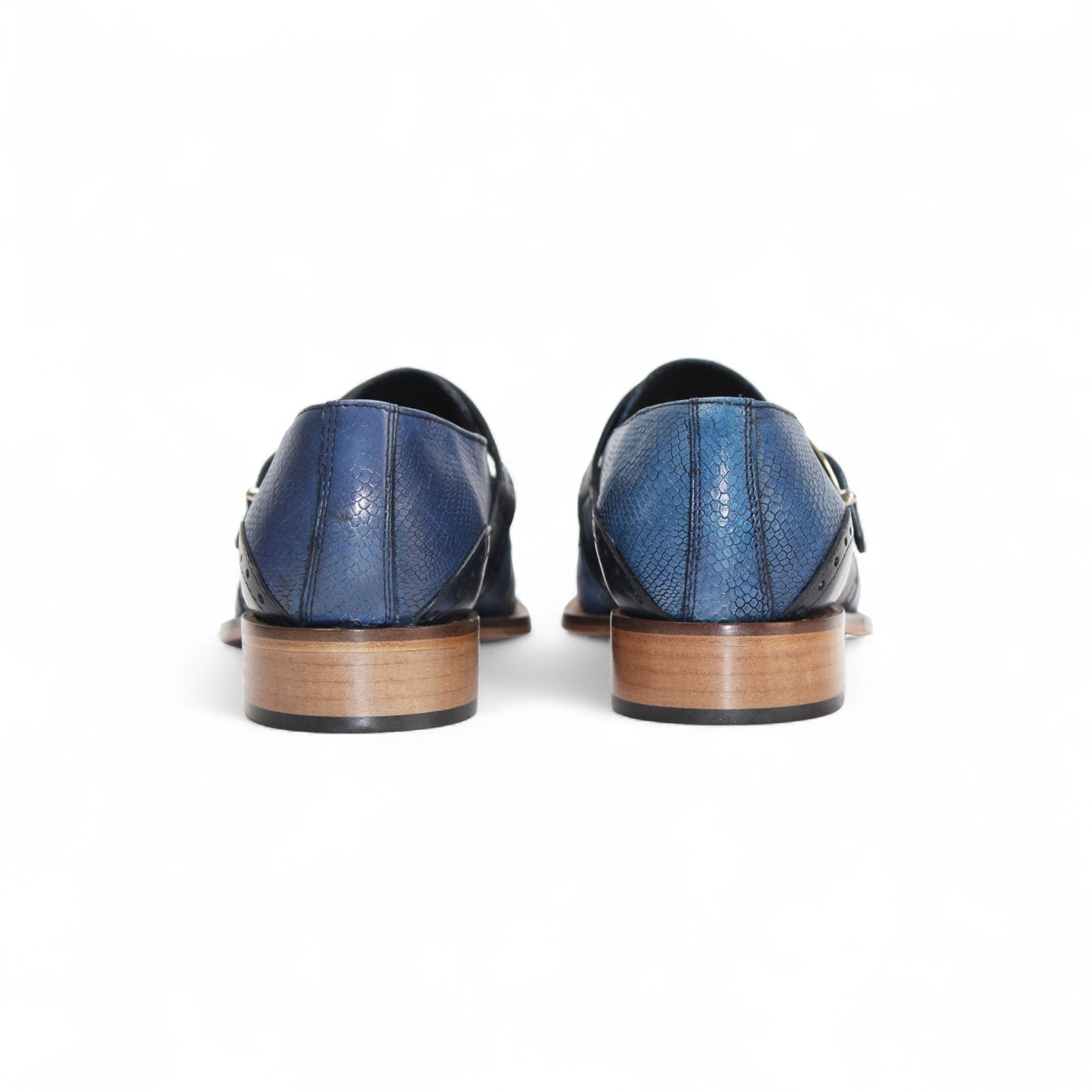 The Duca Di Matiste Duca Sezze Powder Blue/Navy is a luxury leather shoe with blue texture, side buckle, low wooden heel, and pointed toe, crafted in Italy and shown on a white background.