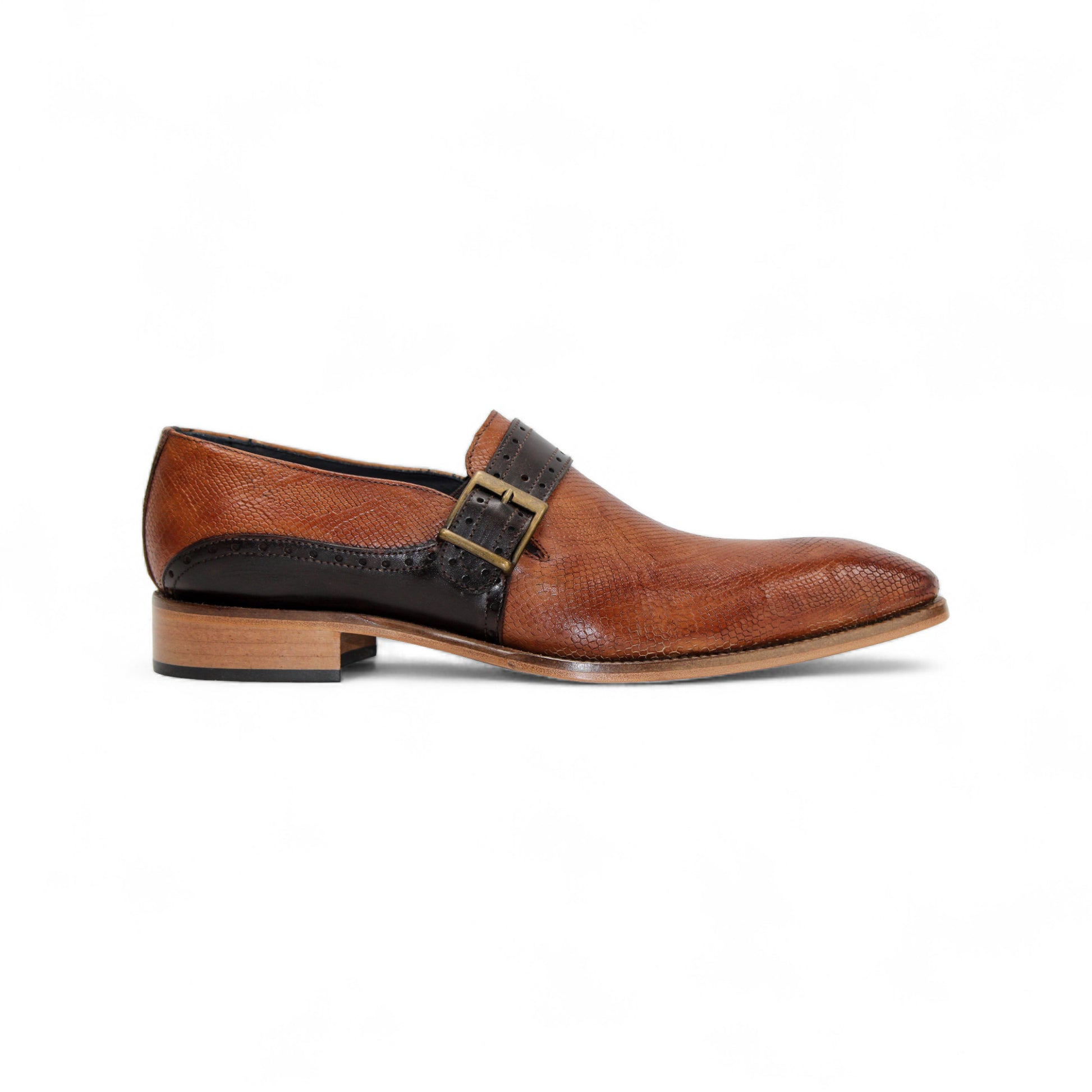 The Duca Sezze Cognac/Chocolate by Duca Di Matiste is a luxurious brown leather dress shoe with a black strap, buckle, and low wooden heel, reflecting Italian craftsmanship in a stylish side profile on a white background.