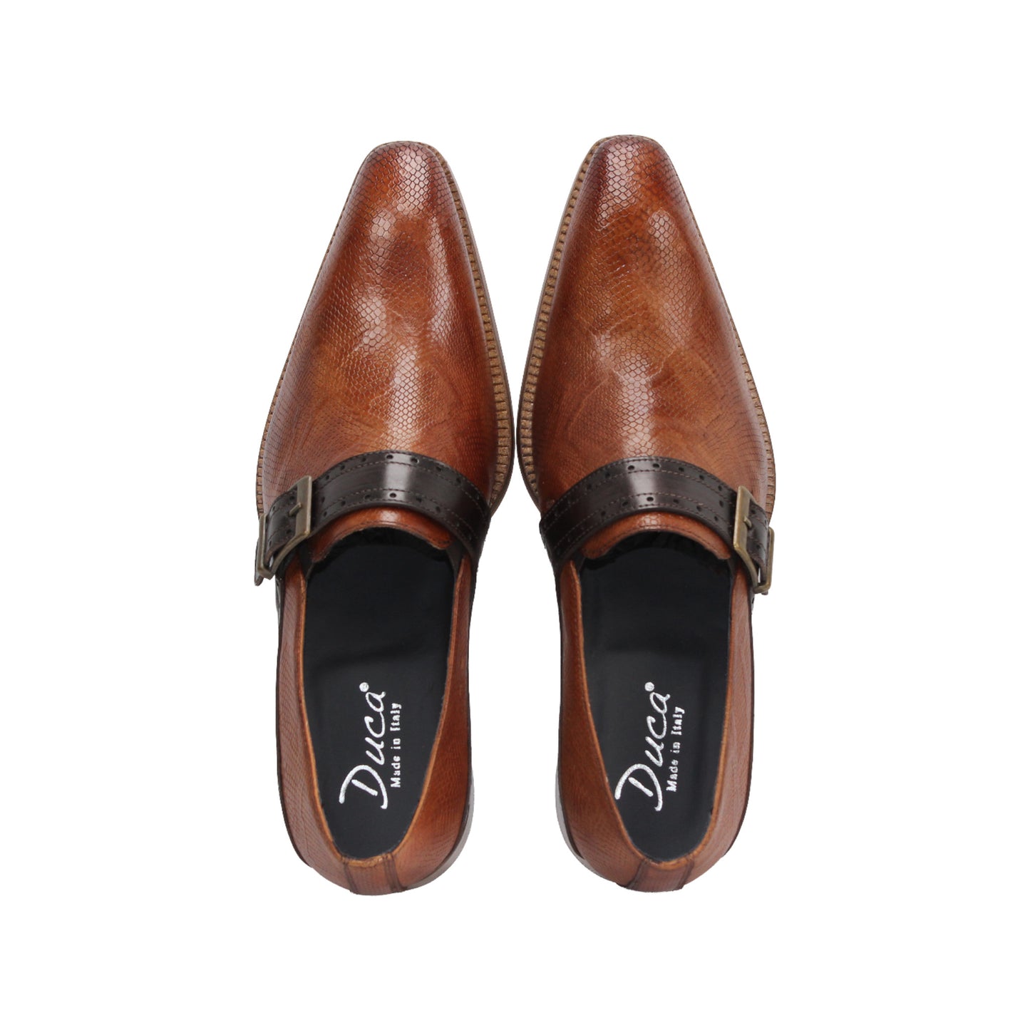 The Duca Sezze Cognac/Chocolate by Duca Di Matiste is a luxurious brown leather dress shoe with a black strap, buckle, and low wooden heel, reflecting Italian craftsmanship in a stylish side profile on a white background.