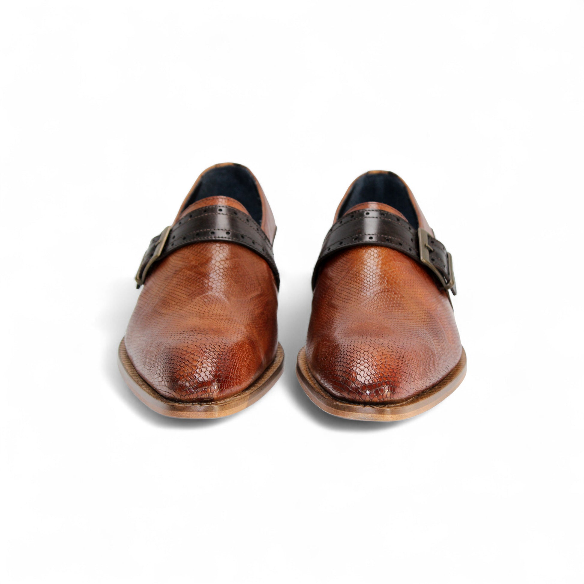 The Duca Sezze Cognac/Chocolate by Duca Di Matiste is a luxurious brown leather dress shoe with a black strap, buckle, and low wooden heel, reflecting Italian craftsmanship in a stylish side profile on a white background.