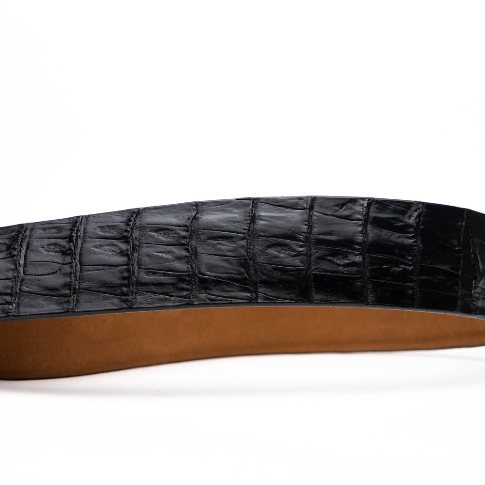 Silvio Belt Black by Marco Di Milano—crafted from black crocodile-embossed leather in the refined style of caiman fuscus-back belts, this belt features meticulous hand-painted finishes and a silver buckle engraved with the Marco Di Milano logo, elegantly coiled on a white background.