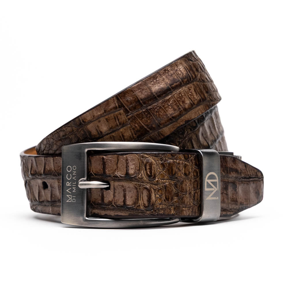 The Silvio Belt Washed Brown by Marco Di Milano is crafted from genuine crocodile-pattern leather and features a metal buckle engraved with the brand’s logo.