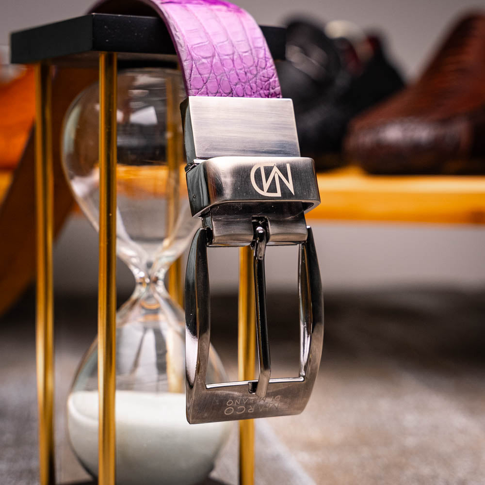 The Silvio Belt Purple by Marco Di Milano is crafted in crocodile-embossed leather with a silver buckle engraved with the brand logo.
