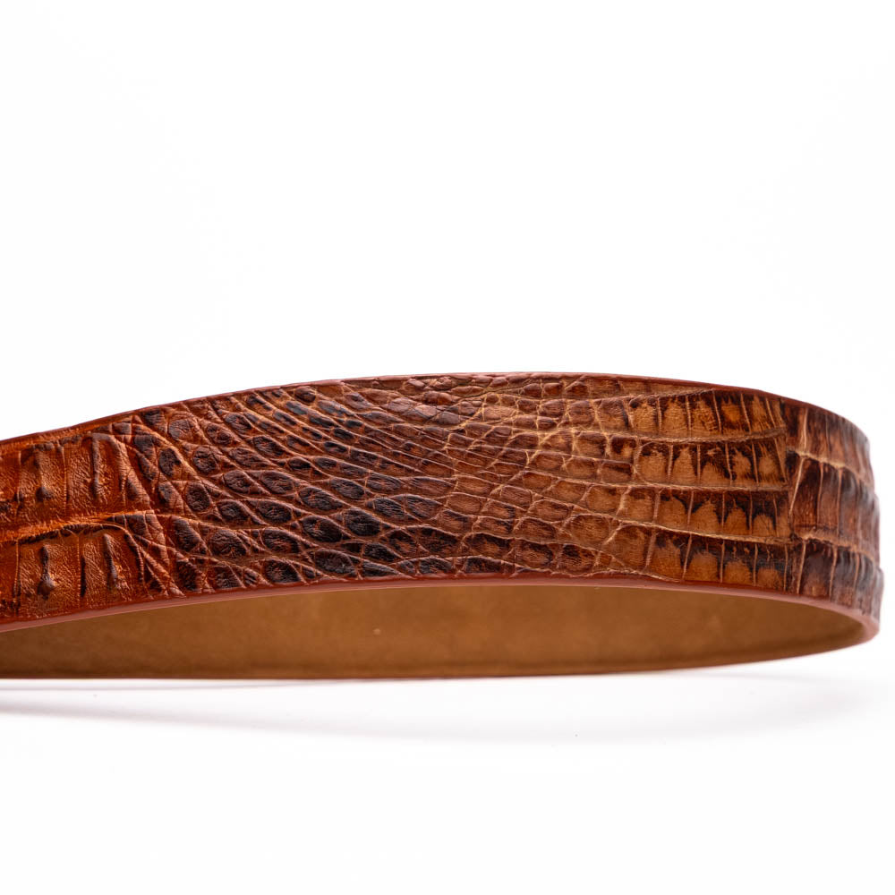 Silvio Belt Rustic Cognac by Marco Di Milano: a brown crocodile-pattern leather belt inspired by caiman fuscus-back, featuring a silver buckle engraved with "MARCO" and "MD"—a signature luxury accessory.