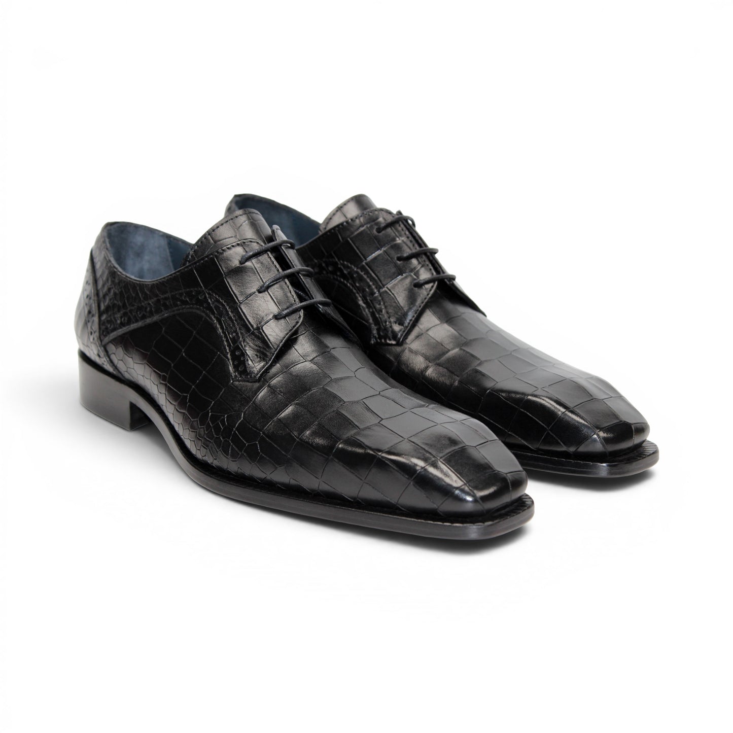 The Duca Di Matiste Duca Spada Black is a black Italian leather dress shoe with an embossed crocodile pattern, low heel, and lace-up design, shown in side profile on a white background. Expertly crafted in Italy for elegant style.