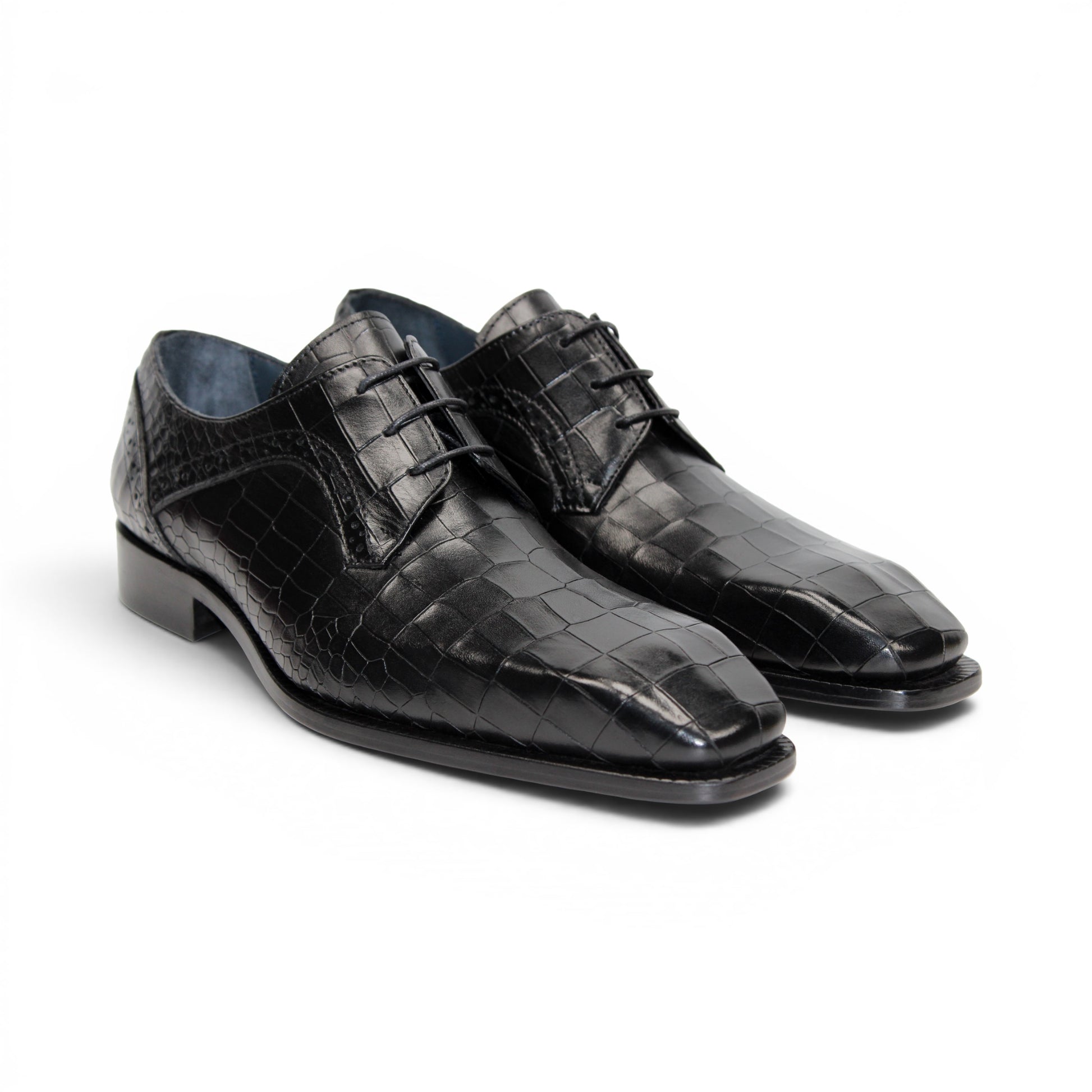 The Duca Di Matiste Duca Spada Black is a black Italian leather dress shoe with an embossed crocodile pattern, low heel, and lace-up design, shown in side profile on a white background. Expertly crafted in Italy for elegant style.