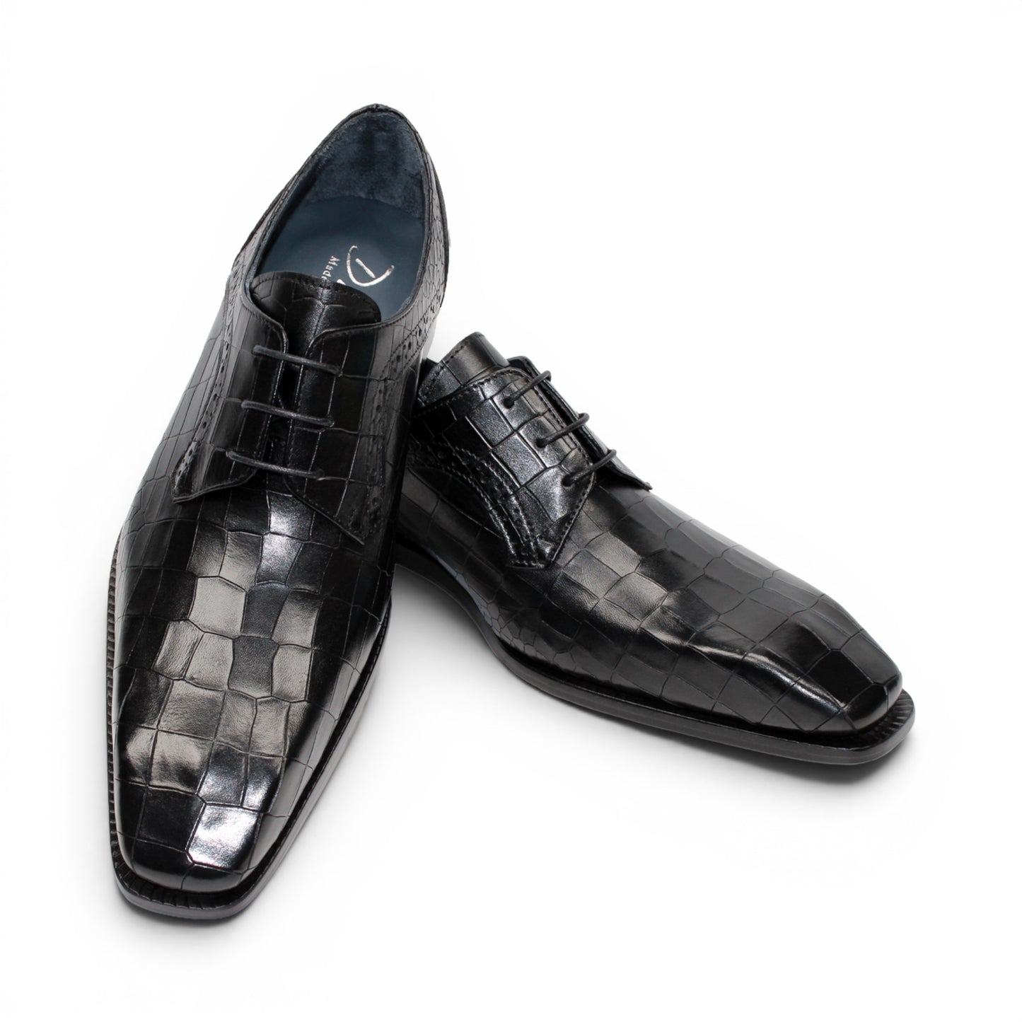 The Duca Di Matiste Duca Spada Black is a black Italian leather dress shoe with an embossed crocodile pattern, low heel, and lace-up design, shown in side profile on a white background. Expertly crafted in Italy for elegant style.