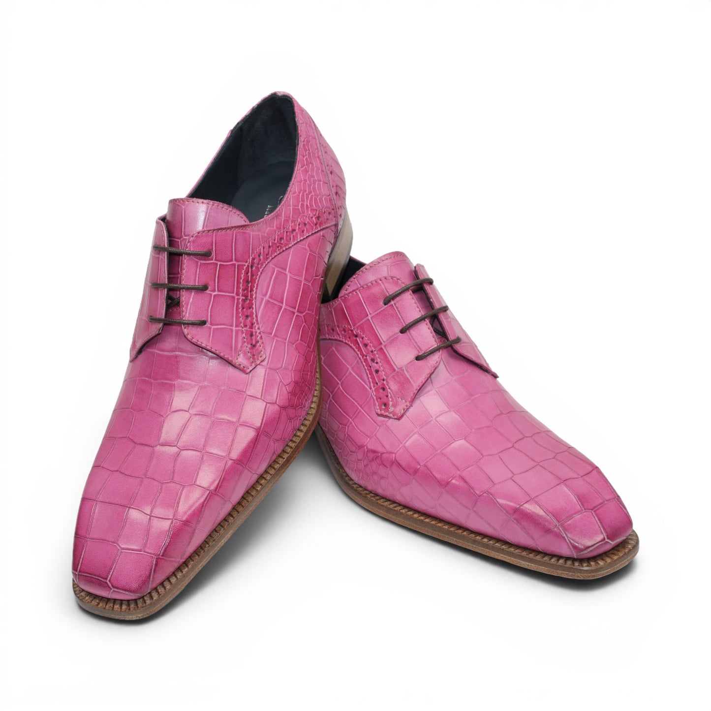 The Duca Di Matiste Duca Spada Pink is a single pink Italian leather dress shoe featuring a crocodile pattern, black laces, and a light brown sole, shown in a side view.