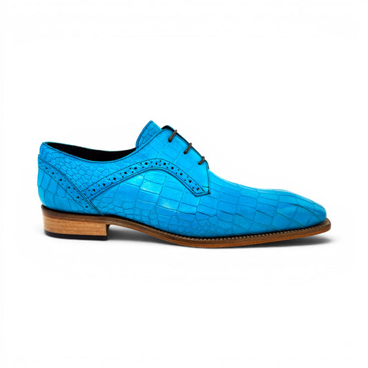 The Duca Di Matiste Duca Spada Turquoise is an Italian-made turquoise leather shoe with a crocodile pattern, black laces, and a light brown sole, shown in side profile against a white background.