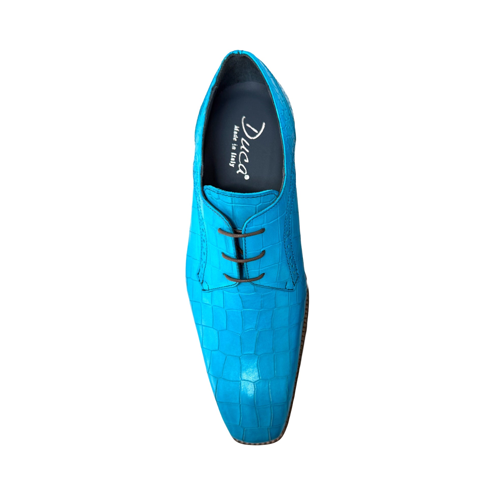 The Duca Di Matiste Duca Spada Turquoise is an Italian-made turquoise leather shoe with a crocodile pattern, black laces, and a light brown sole, shown in side profile against a white background.