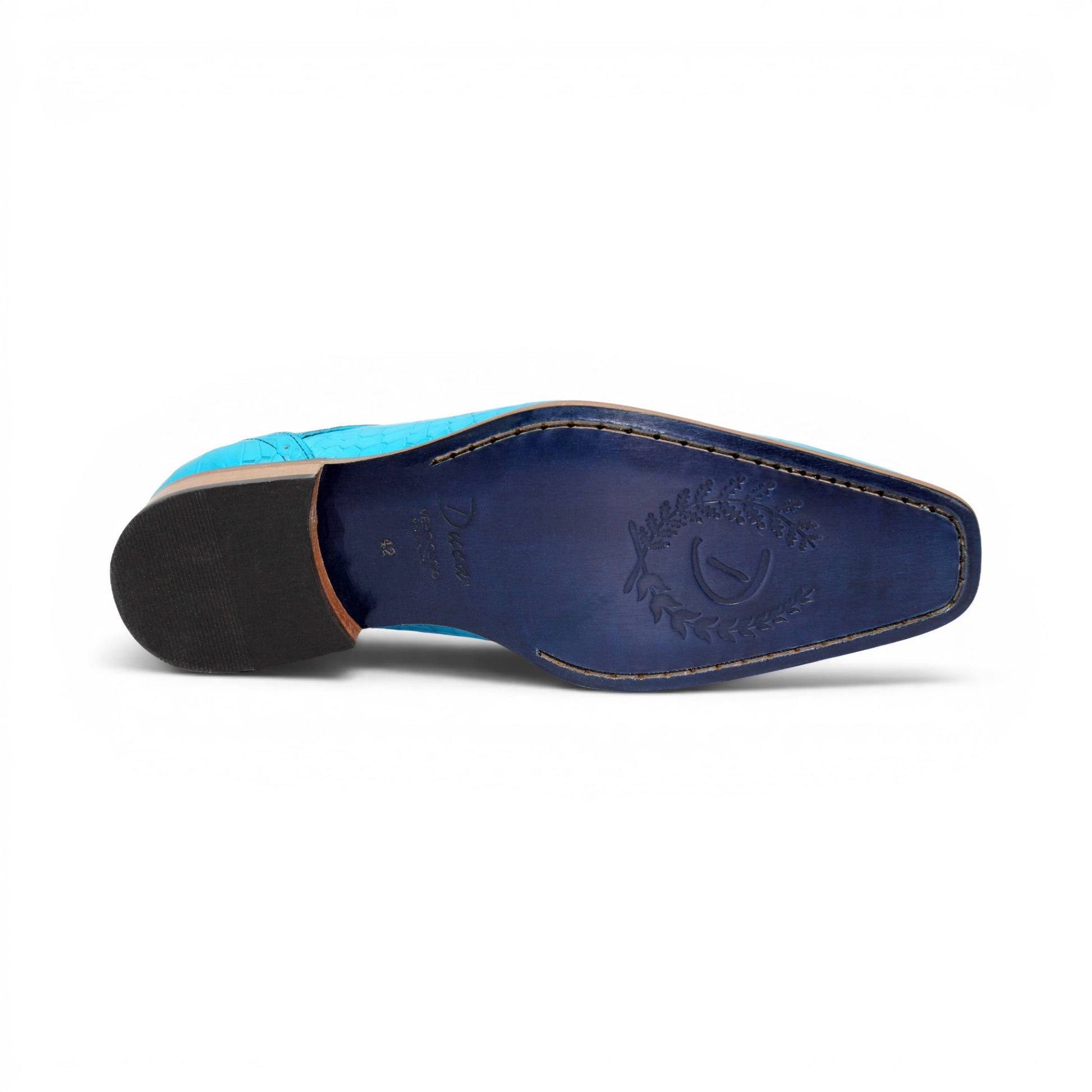 The Duca Di Matiste Duca Spada Turquoise is an Italian-made turquoise leather shoe with a crocodile pattern, black laces, and a light brown sole, shown in side profile against a white background.