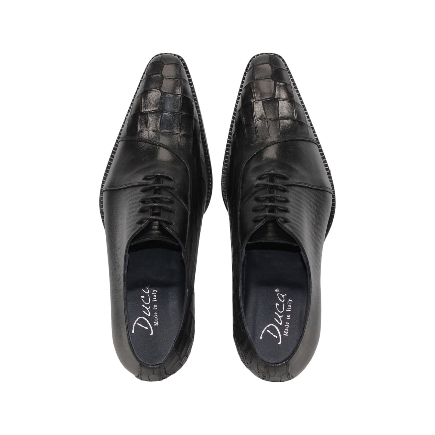 The Duca Spoleto I Black by Duca Di Matiste is a black luxury leather shoe with a pointed toe and embossed pattern, shown in a side view against a white background.