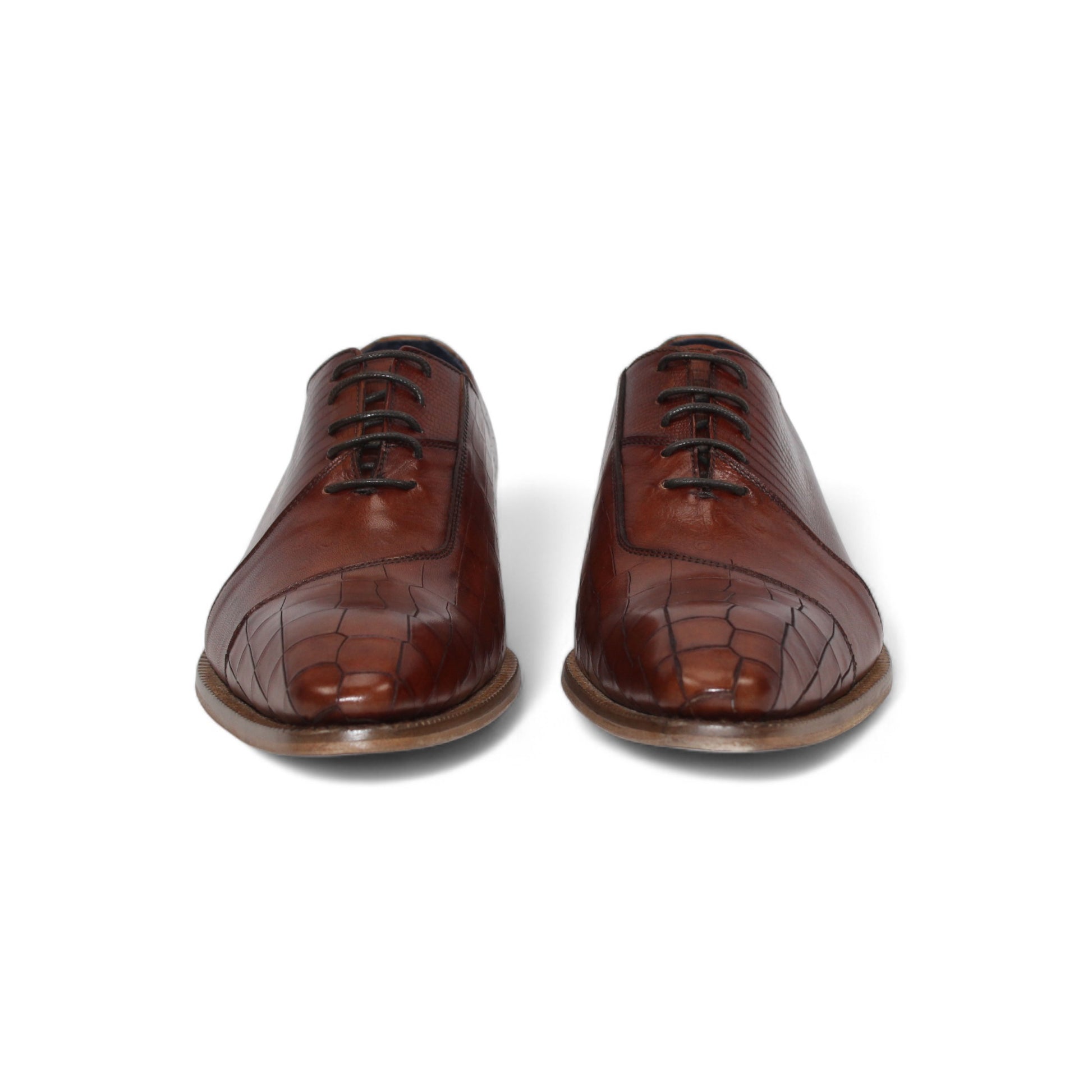 The Duca Spoleto I Brandy by Duca Di Matiste is a brown leather dress shoe with a slight heel, lace-up design, and embossed textured finish, shown in side profile on a white background.
