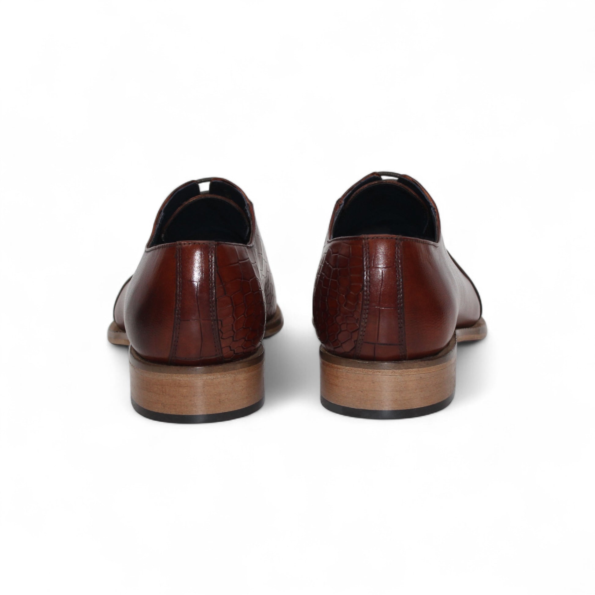 The Duca Spoleto I Brandy by Duca Di Matiste is a brown leather dress shoe with a slight heel, lace-up design, and embossed textured finish, shown in side profile on a white background.