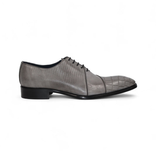 The Duca Di Matiste Duca Spoleto I Grey is a gray embossed leather oxford with a textured toe and side, black sole, and black laces—luxury footwear shown in side profile on a white background.