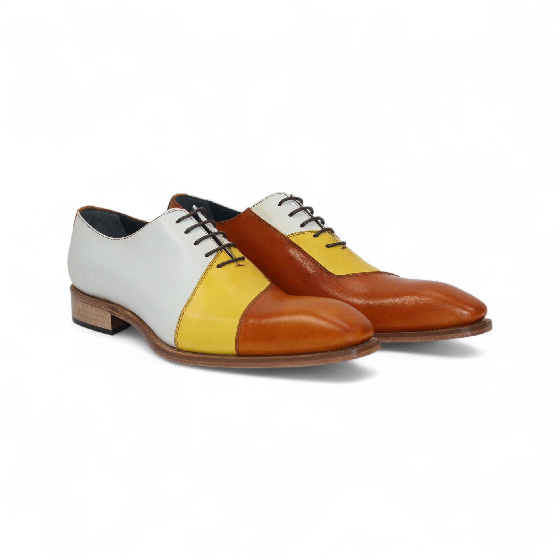The Duca Spoleto II Yellow Combo by Duca Di Matiste is a luxury leather dress shoe in white, yellow, and brown color blocks with black laces and a light brown sole, expertly handcrafted in Italy and shown in side view on a white background.