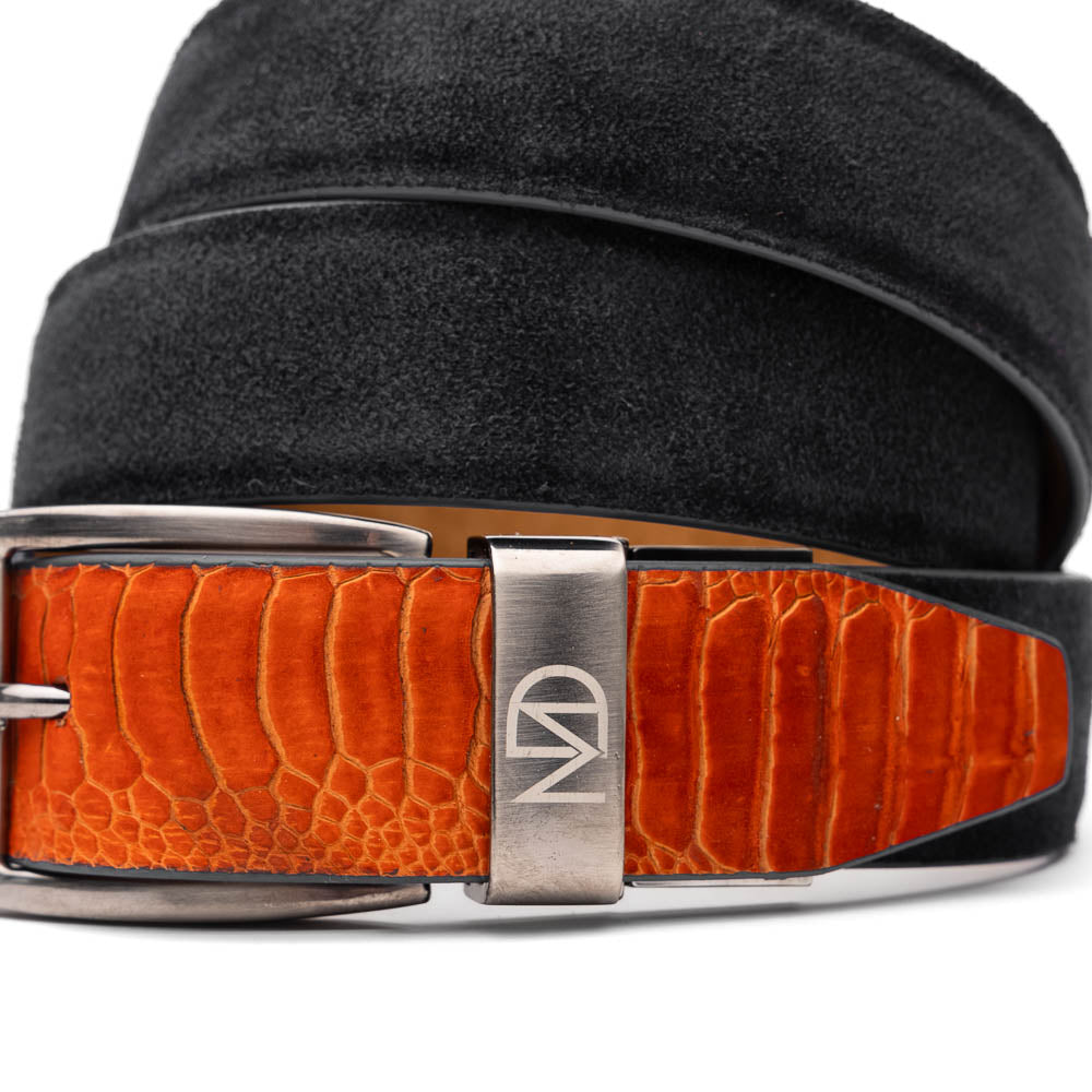 The Hugo Belt Orange / Black by Marco Di Milano features ostrich leg suede in black and orange, a silver buckle engraved with "Marco" and "MD," and a textured orange pattern—ideal for pairing with Marco Di Milano luxury footwear.