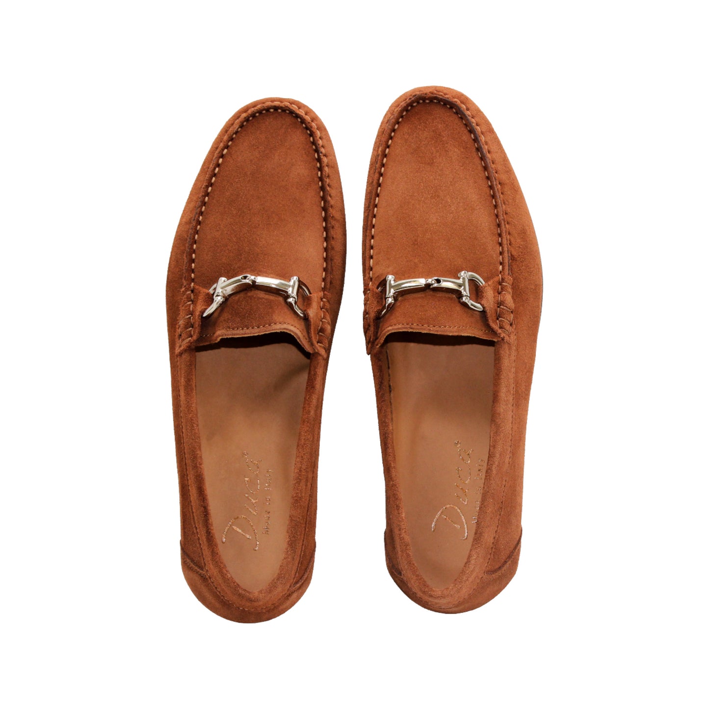 The Duca Di Matiste Duca Termoli Rust is a brown suede loafer with a silver bit, low heel, and moccasin-style stitching, displayed in side profile on a white background.