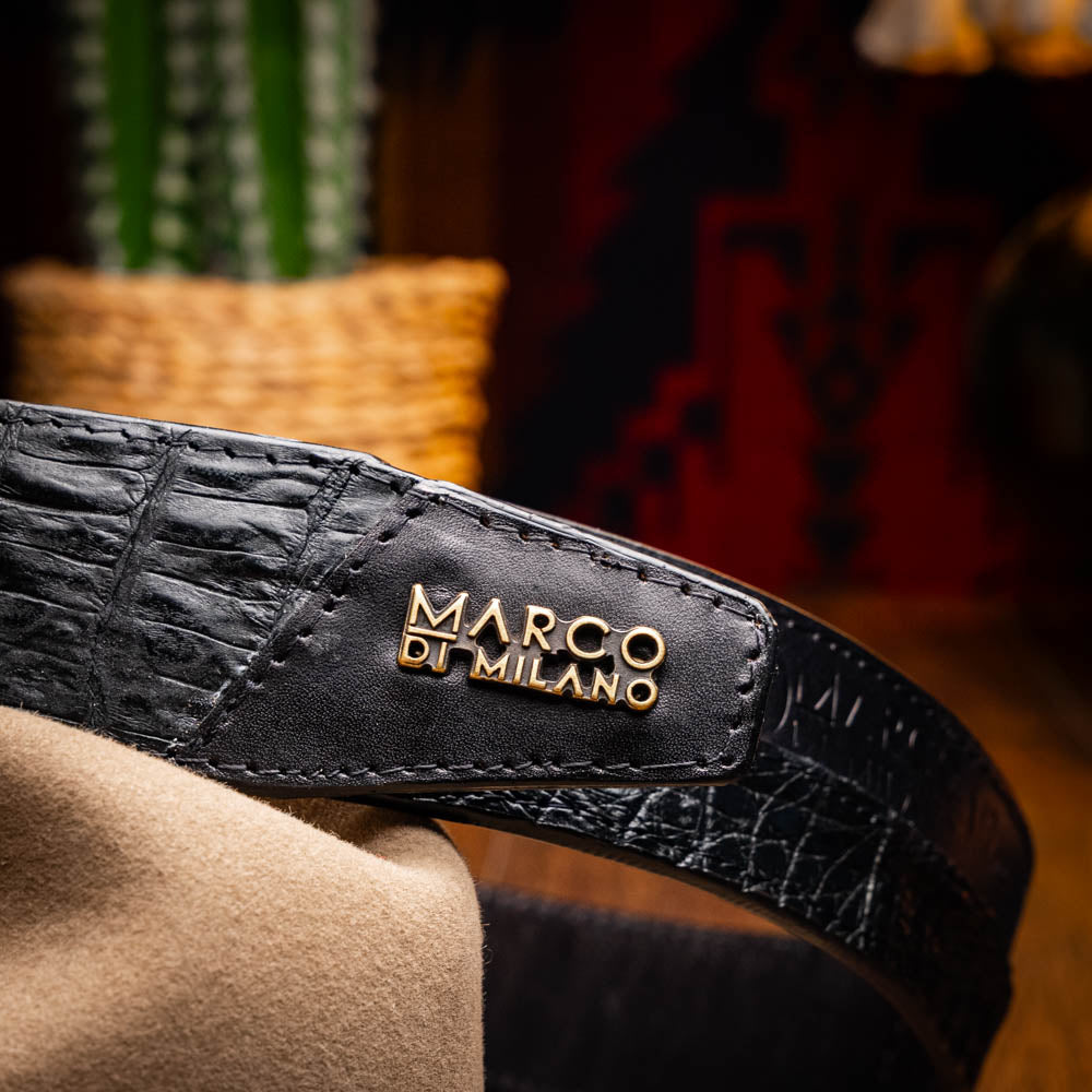 The Texas Belt Black by Marco Di Milano features a bold gold "MD" buckle and embossed branding, styled like a Western belt for a striking statement.