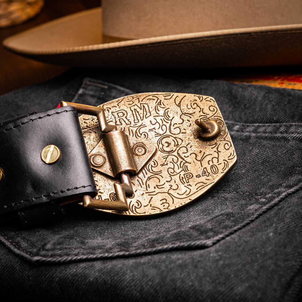 The Texas Belt Black by Marco Di Milano features a bold gold "MD" buckle and embossed branding, styled like a Western belt for a striking statement.