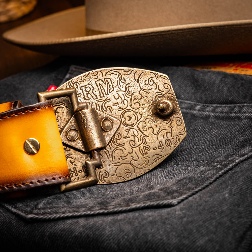The Texas Belt Mustard Brown by Marco Di Milano features a striking gold "MD" logo buckle—an elegant statement accessory embodying modern sophistication.