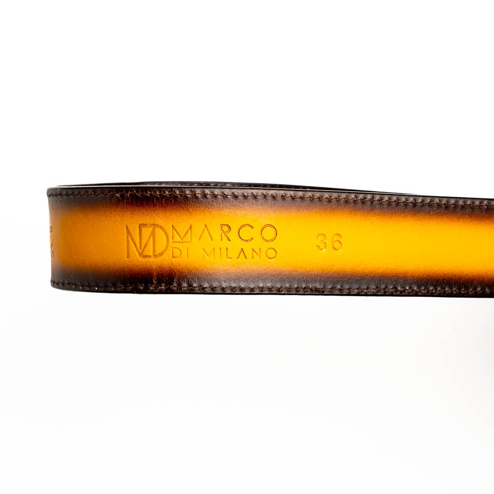 The Texas Belt Mustard Brown by Marco Di Milano features a striking gold "MD" logo buckle—an elegant statement accessory embodying modern sophistication.