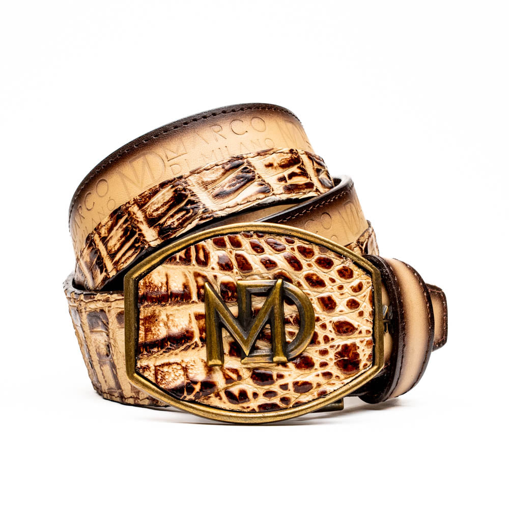 The Texas Belt Stone Orix by Marco Di Milano features embossed tan and brown caiman crocodile leather with a large gold and brown MD logo buckle, shown rolled up against a white background.