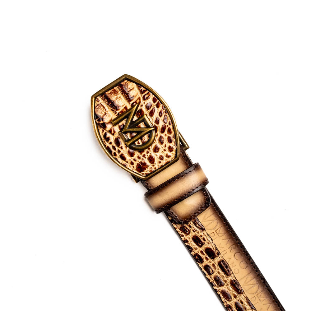 The Texas Belt Stone Orix by Marco Di Milano features embossed tan and brown caiman crocodile leather with a large gold and brown MD logo buckle, shown rolled up against a white background.