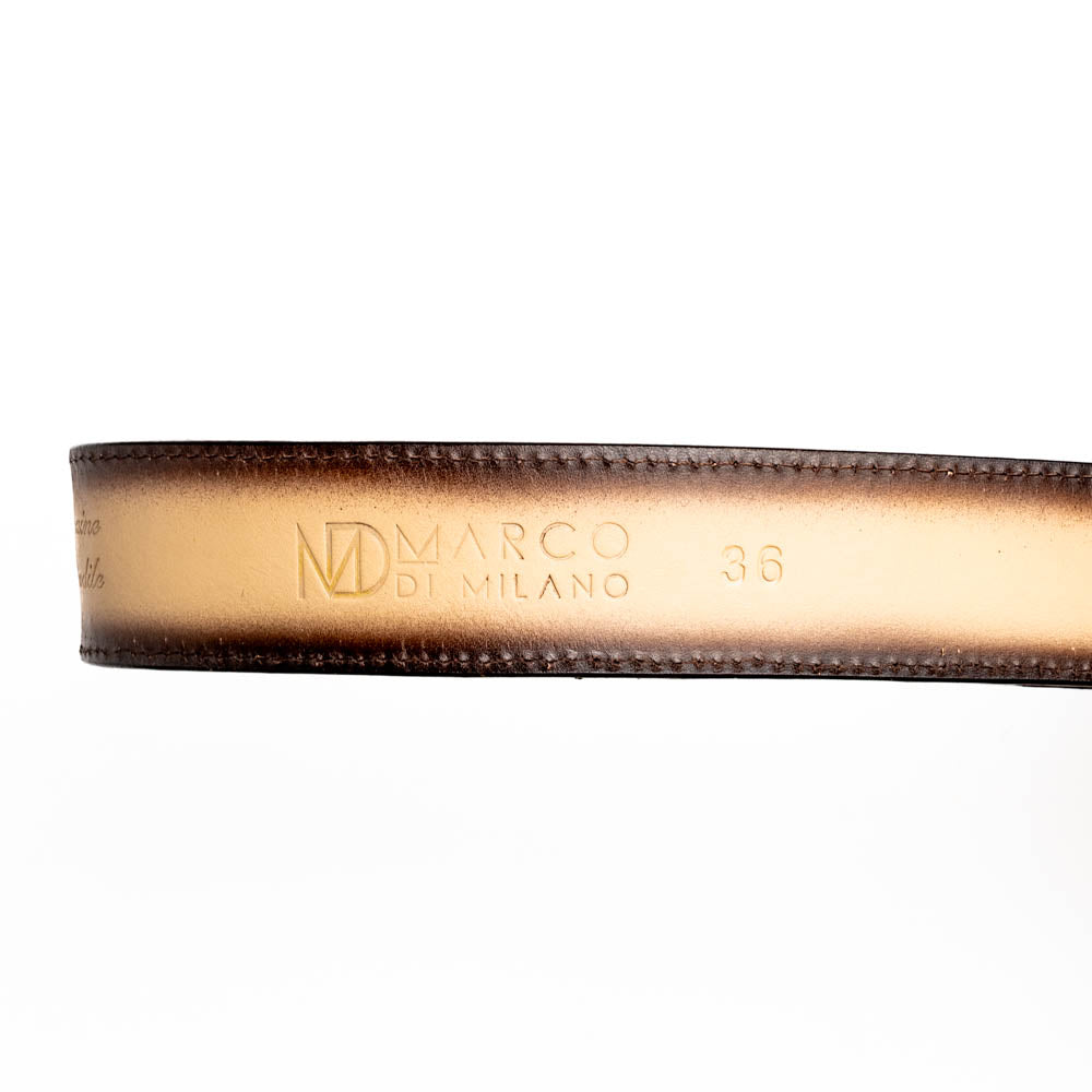 The Texas Belt Stone Orix by Marco Di Milano features embossed tan and brown caiman crocodile leather with a large gold and brown MD logo buckle, shown rolled up against a white background.