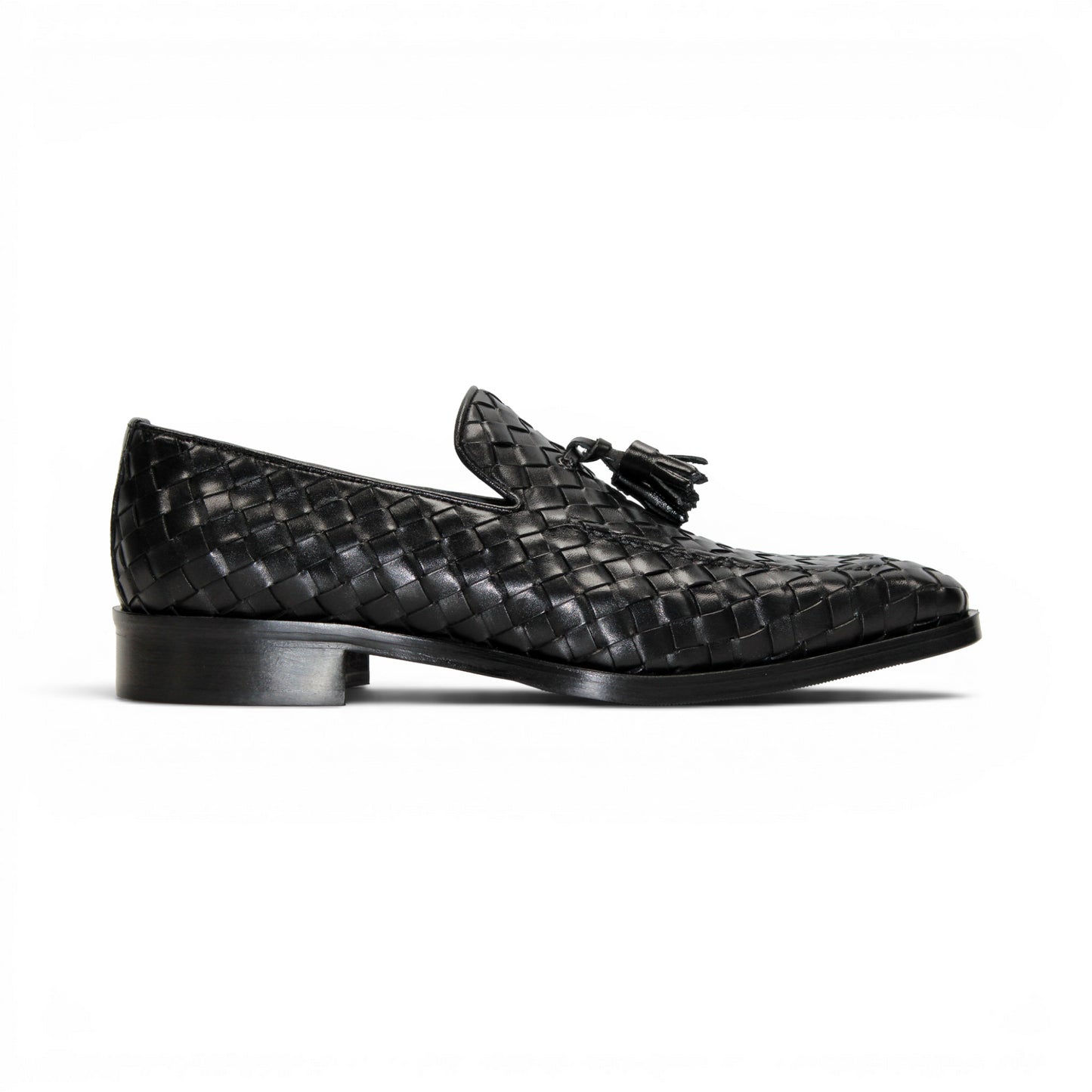 The Duca Di Matiste Duca Tirrenea Black is a black calf weave leather loafer with tassel detail, low heel, and rounded toe, shown in side profile on a white background—an elegant piece of luxury footwear.