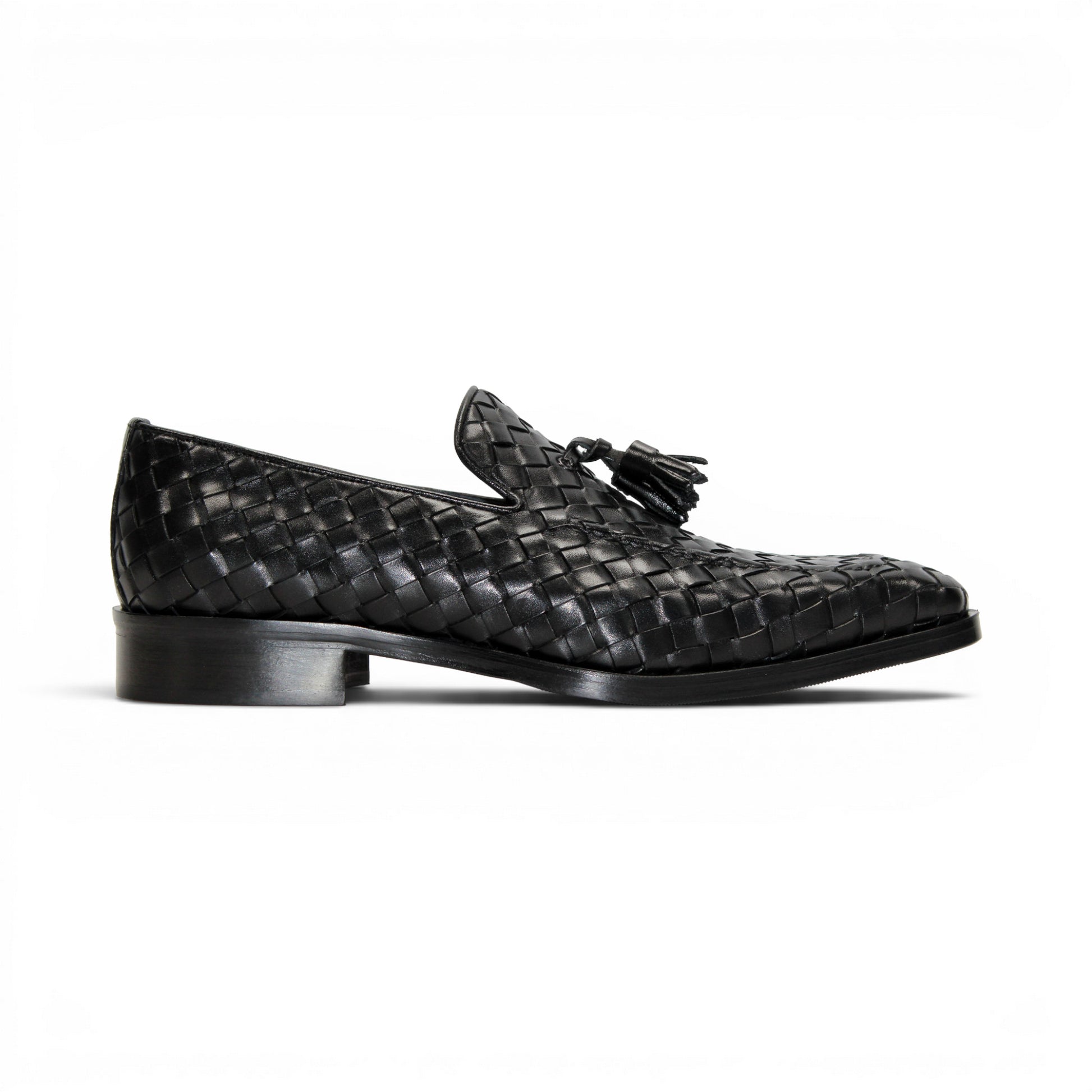 The Duca Di Matiste Duca Tirrenea Black is a black calf weave leather loafer with tassel detail, low heel, and rounded toe, shown in side profile on a white background—an elegant piece of luxury footwear.