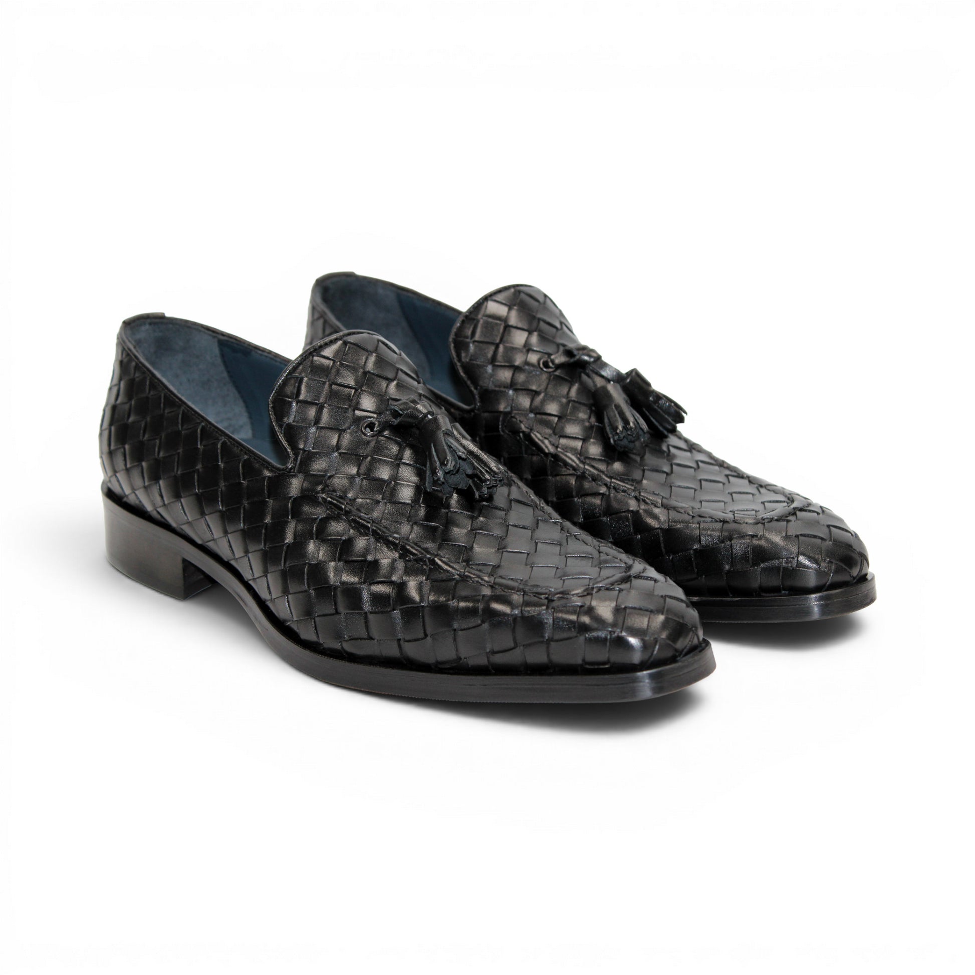 The Duca Di Matiste Duca Tirrenea Black is a black calf weave leather loafer with tassel detail, low heel, and rounded toe, shown in side profile on a white background—an elegant piece of luxury footwear.