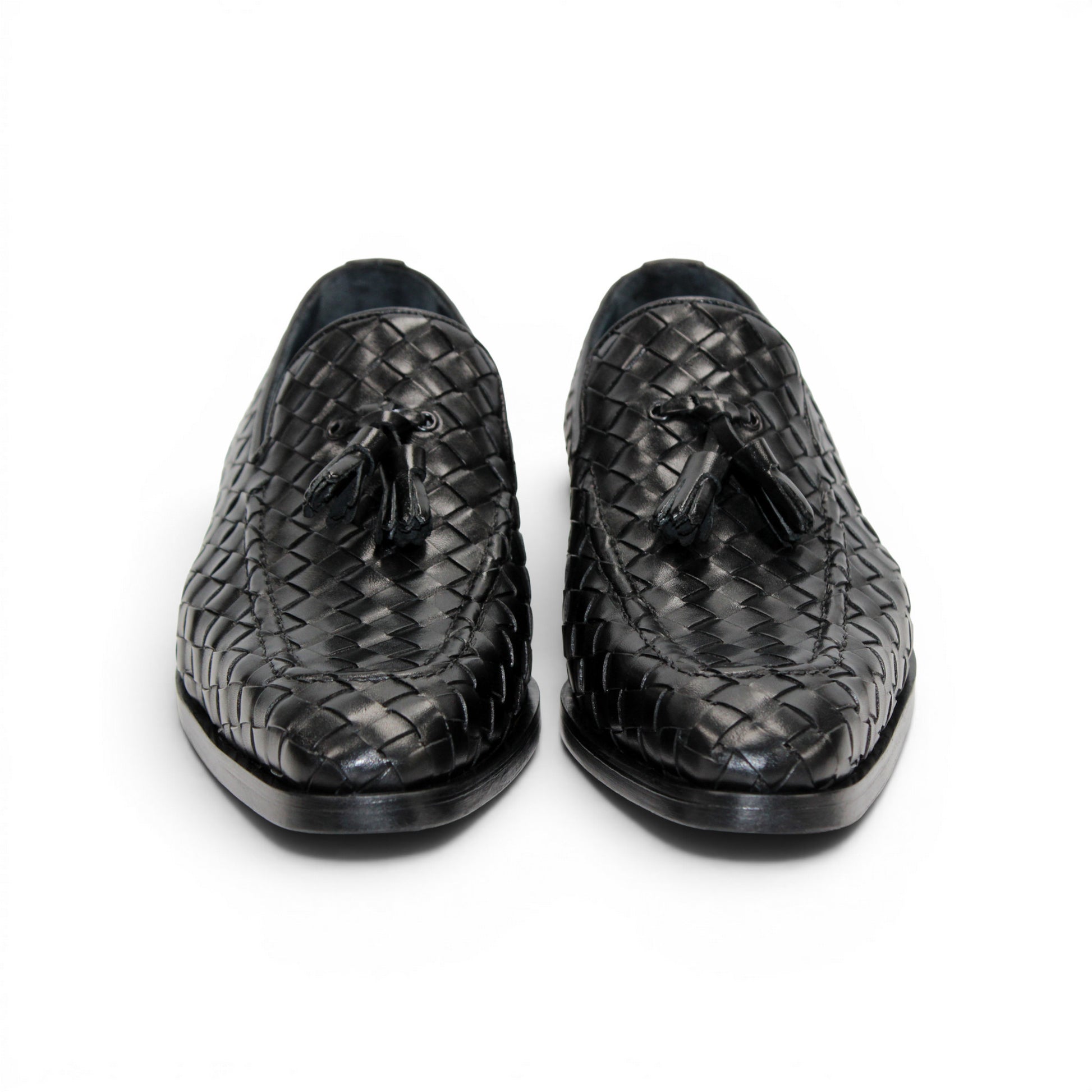 The Duca Di Matiste Duca Tirrenea Black is a black calf weave leather loafer with tassel detail, low heel, and rounded toe, shown in side profile on a white background—an elegant piece of luxury footwear.