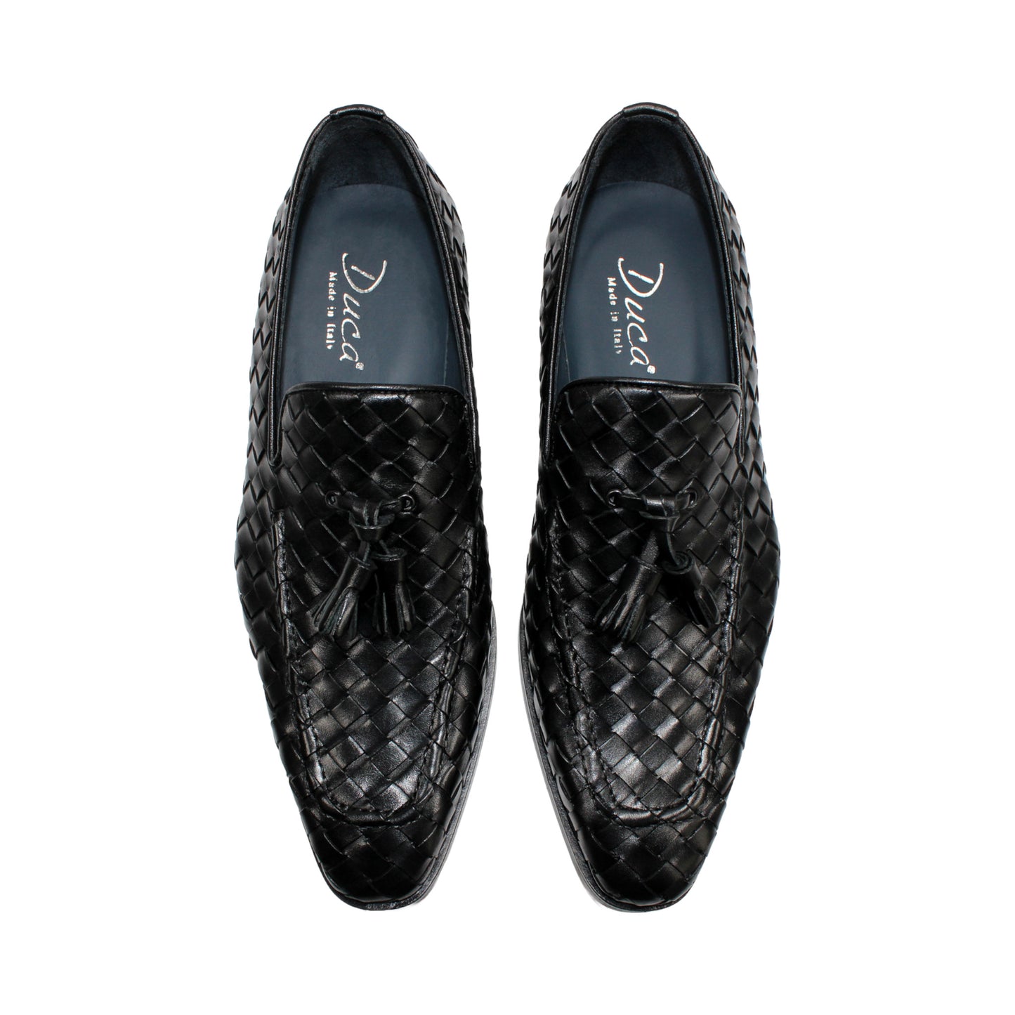 The Duca Di Matiste Duca Tirrenea Black is a black calf weave leather loafer with tassel detail, low heel, and rounded toe, shown in side profile on a white background—an elegant piece of luxury footwear.
