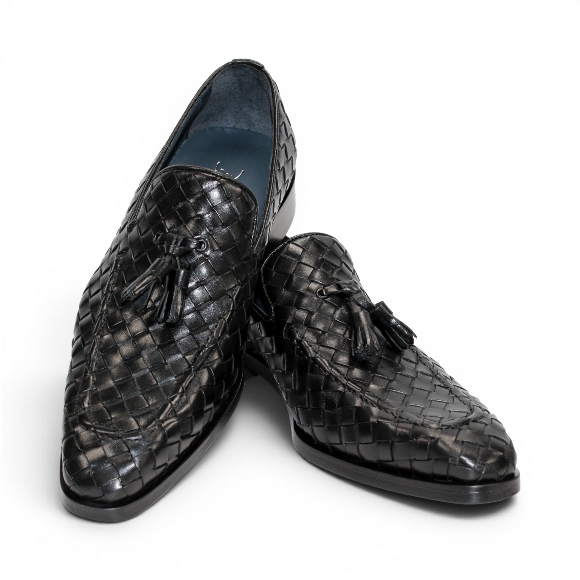 The Duca Di Matiste Duca Tirrenea Black is a black calf weave leather loafer with tassel detail, low heel, and rounded toe, shown in side profile on a white background—an elegant piece of luxury footwear.