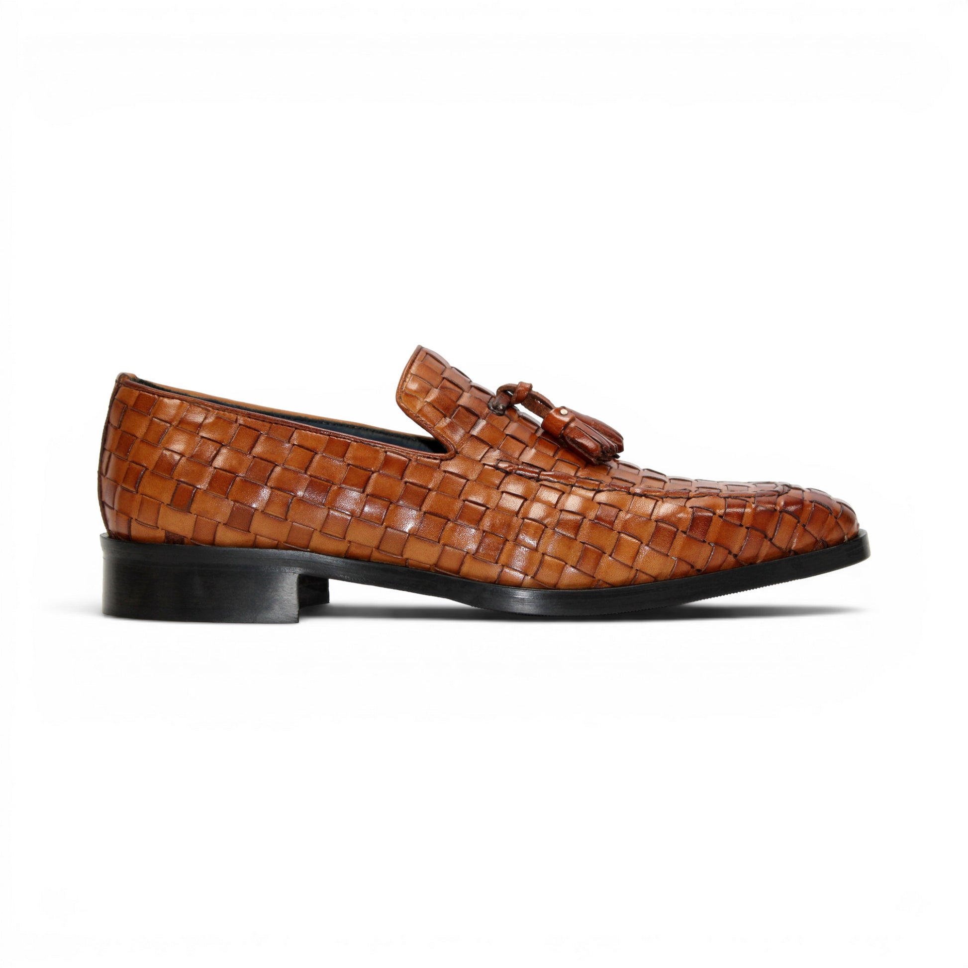 Duca Di Matiste's Duca Tirrenea Cognac: a brown Italian calf weave leather loafer with tassels, low heel, and black sole—luxury footwear shown in side profile on a white background.