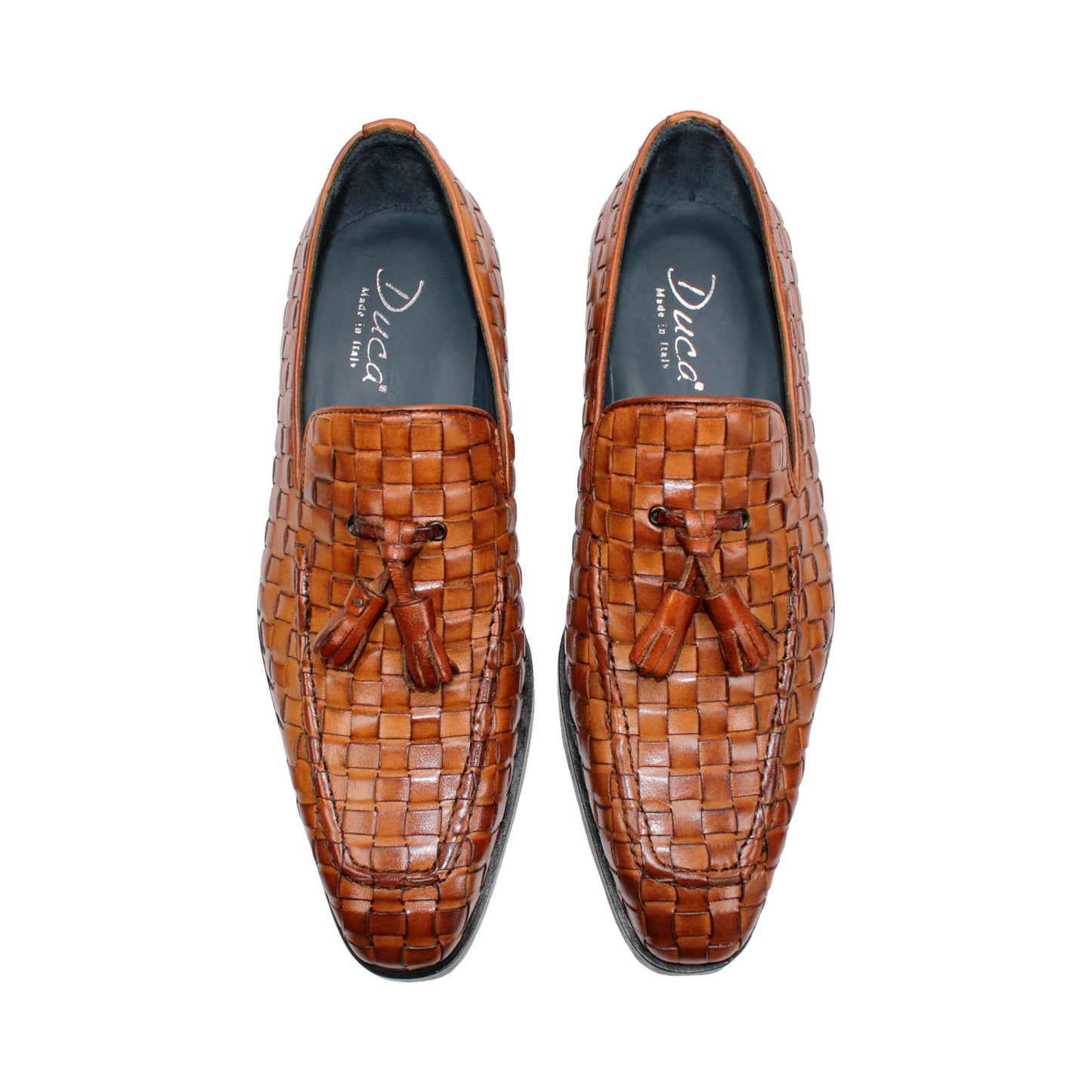 Duca Di Matiste's Duca Tirrenea Cognac: a brown Italian calf weave leather loafer with tassels, low heel, and black sole—luxury footwear shown in side profile on a white background.