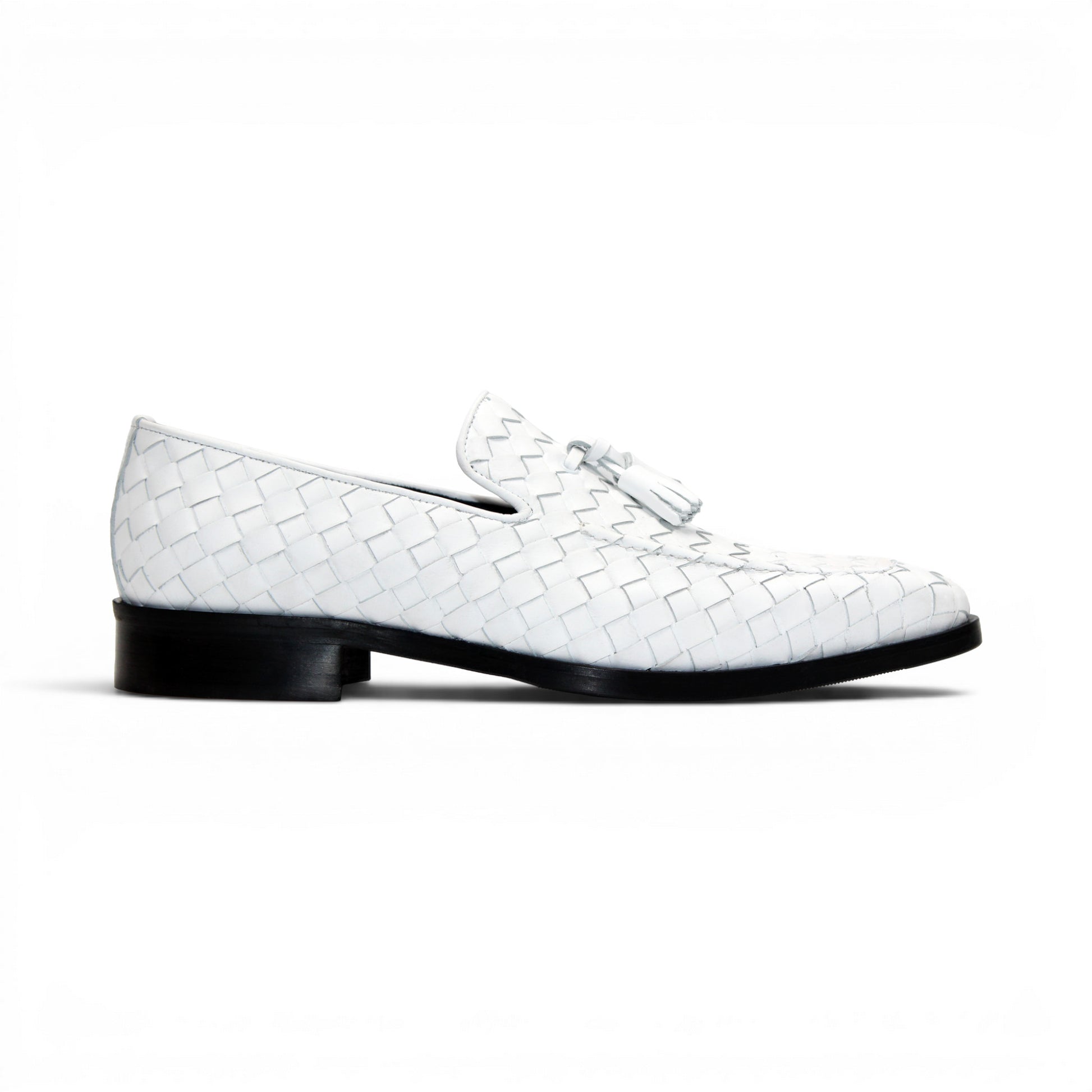 The Duca Tirrenea White by Duca Di Matiste is a white calf weave leather loafer with tassel detail and a black low heel, elegantly crafted in Italy and shown in profile against a plain white background.